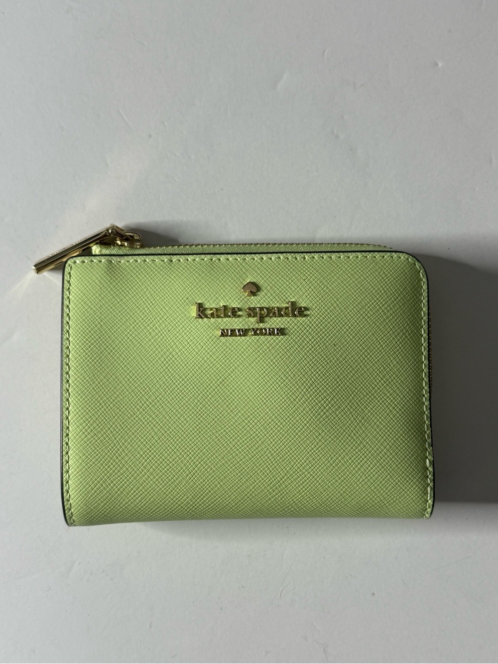 kate spade lime green zip-around compact wallet